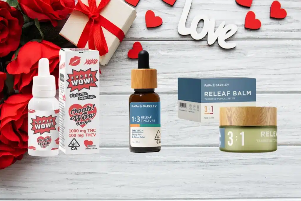  A romantic Weed Valentines Gift display featuring cannabis-infused tinctures and balms, including Super Wow Oooh! Wow Drops and Papa & Barkley Releaf Tincture and Balm. The products are set against a wooden background with roses, hearts, and a wrapped gift, creating the perfect cannabis-themed Valentine's Day present.